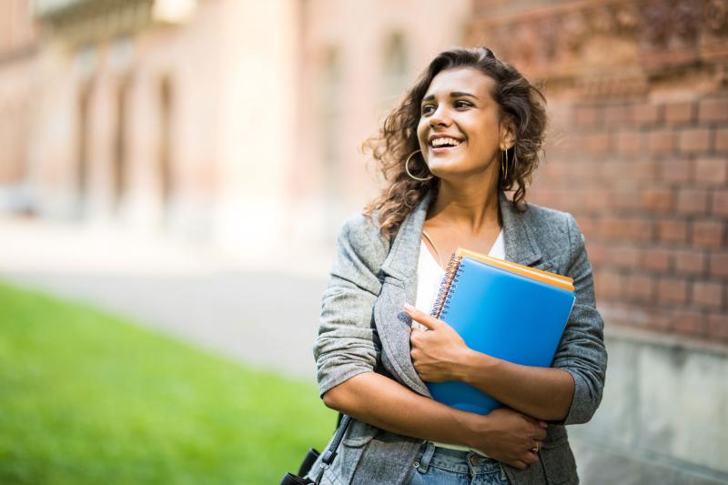 Female student walking outside.