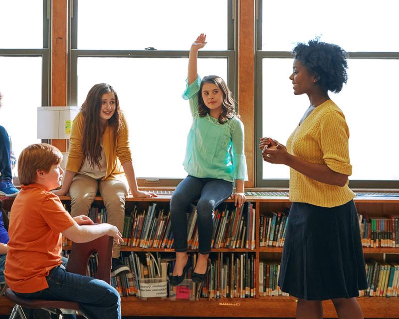 Teacher with three students.