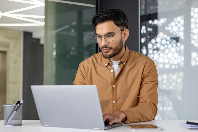 Man sitting at a computer.